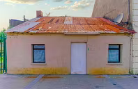 DERELICT WITH TIN ROOF